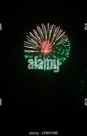 A scenic view of beautiful fireworks exploding in the skies of Doha ...