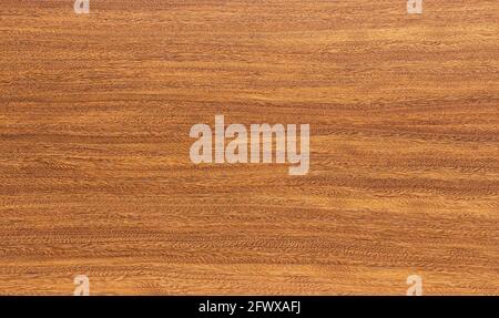 Sheesham wood veneer background. Background of a brown wood texture. Stock Photo