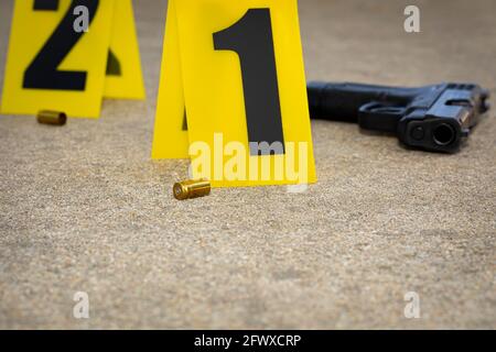 Gun shell casing at crime scene. Gun violence, mass shooting and homicide investigation concept. Stock Photo