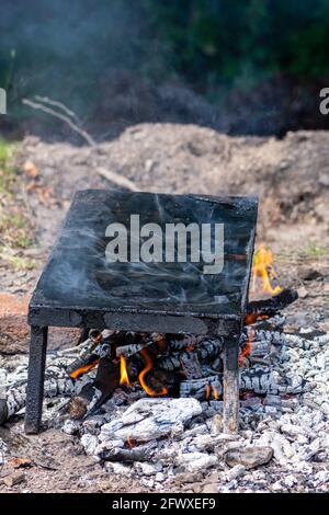 Empty stone grill plate in the nature Stock Photo