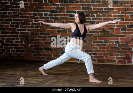 Athlete woman practicing yoga. Stock Photo