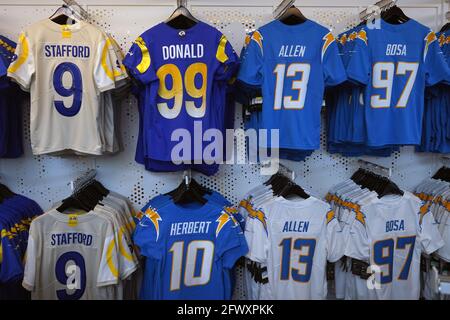 Los Angeles Rams and Los Angeles Chargers jerseys on display at