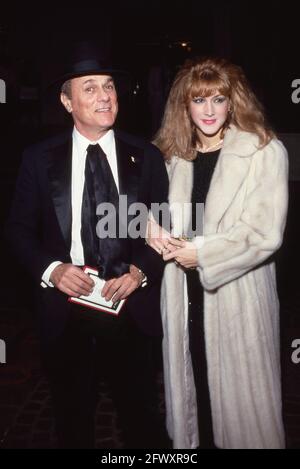 Tony Curtis and Andrea Savio Circa 1980's Credit: Ralph Dominguez/MediaPunch Stock Photo