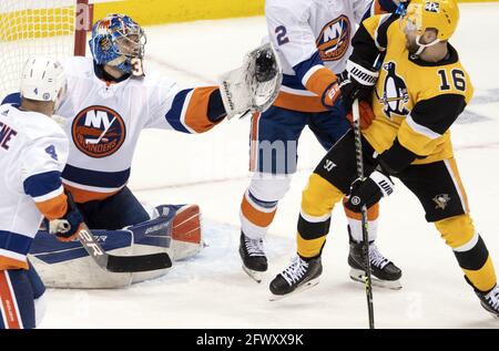 Pittsburgh, United States. 24th May, 2021. New York Islanders goaltender Ilya Sorokin (30) makes a glove save during the first overtime period in game 5 of opening round of the NHL Stanley Cup playoff series at PPG Paints Arena in Pittsburgh on Monday, May 24, 2021. Photo by Archie Carpenter/UPI Credit: UPI/Alamy Live News Stock Photo