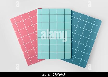 Checkered notebooks on white background Stock Photo