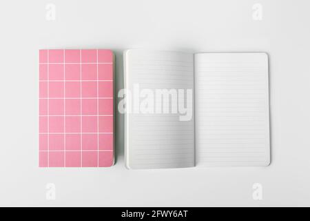 Checkered notebooks on white background Stock Photo