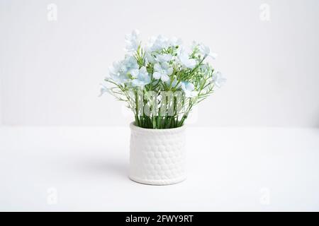 Fake flower pots in a vase on white background, Plastic flower Stock Photo