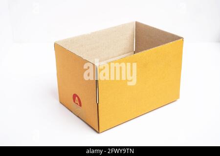 Empty open and closed brown cardboard box isolated on white background with tape. Suitable for packaging. Stock Photo