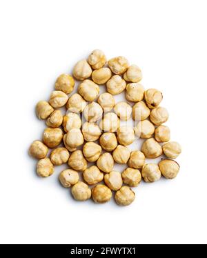 Peeled roasted hazelnuts isolated on white background. Stock Photo