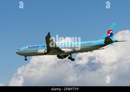 Richmond, British Columbia, Canada. 18th May, 2021. A Korean Air Airbus A330-300 jet (HL8003) airborne on final approach for landing at Vancouver International Airport. Credit: Bayne Stanley/ZUMA Wire/Alamy Live News Stock Photo