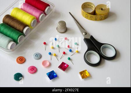 High angle view of sewing items on white background Stock Photo