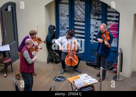 London. UK- 05.23.2021. A classical music band performing in the South Hall of Covent Garden Market. Stock Photo