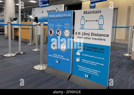 COVID-19 safety travel advisories signs at Gate 48B of Terminal 4 of the Los Angeles International Airport, Tuesday, May 24, 2021, in Los Angeles. Kir Stock Photo