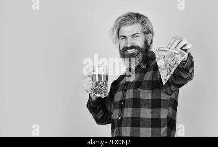 Having fun and drink in bar. nice pub menu. man watching football while drinking beer and eating pizza. eating pizza and drinking. take-away pizza Stock Photo