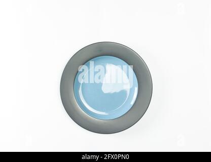 Indonesian-made ceramic plates are Tosca green and old Tosca on a white background Stock Photo