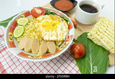 Indonesian Mie Goreng or Fried Noodle with egg traditional Indonesian or Chinese food Stock Photo