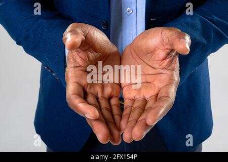 Close up of african american businessman with cupped hands