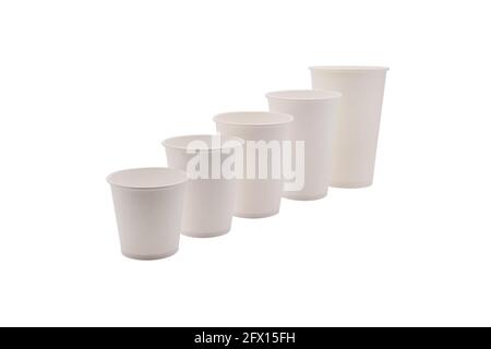 Disposable white paper cups, isolated on white background. Takeaway drinks. Stock Photo