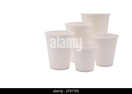 Disposable white paper cups, isolated on white background. Takeaway drinks. Stock Photo