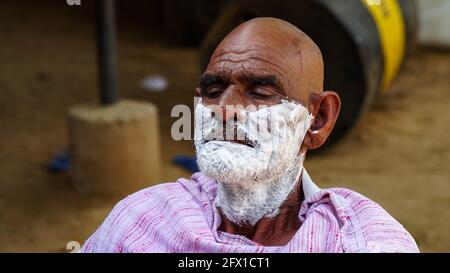 01 January 2021- Reengus, Sikar, India. Indian rural landscape, Local barber go to every day door to door to shave villagers. Stock Photo