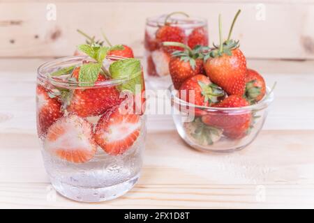 fresh Strawberry mojito cocktail with ice and mint in glass fruit to make water in the summer. Stock Photo