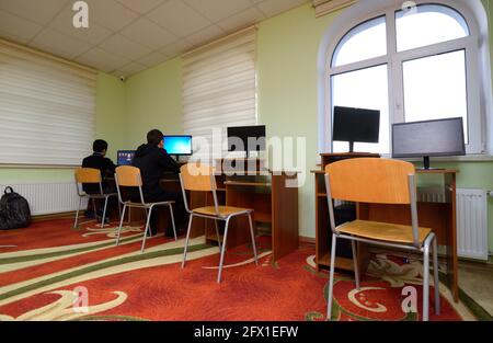 two boys in front of a computer Stock Photo - Alamy