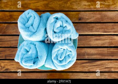 Clean and Rolled Towels on Bathroom Table Close To Tub Stock Image - Image  of beauty, bath: 261918459