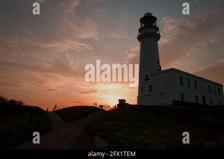 The iconic lighthouse at Flambrough Head as the sun goes down Stock Photo