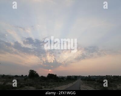 Beautiful cloudy sky with sun rays. Cloudy abstract background. Sunset light. light beam during sunrise Stock Photo