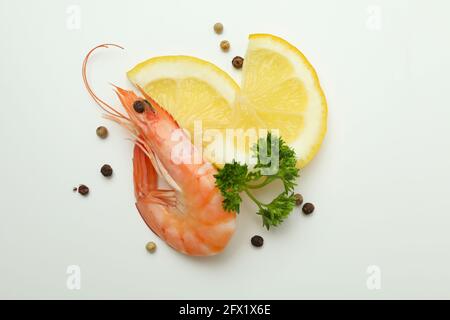 Tasty cooked shrimp and spices on white background Stock Photo