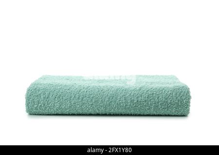 Green folded towel isolated on white background Stock Photo