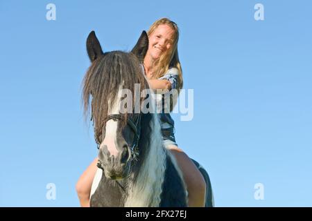 Young rider bareback on an Irish Cob horse Stock Photo