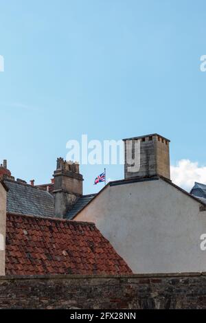 A Union Jack flying over the city of wells in the summer. Stock Photo