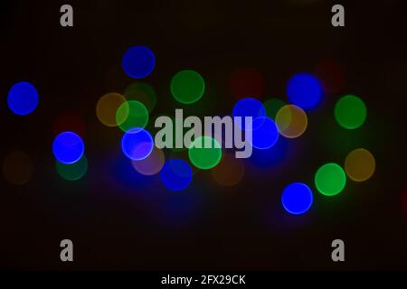 Abstract background, multicolored bokeh on a black background. Stock Photo