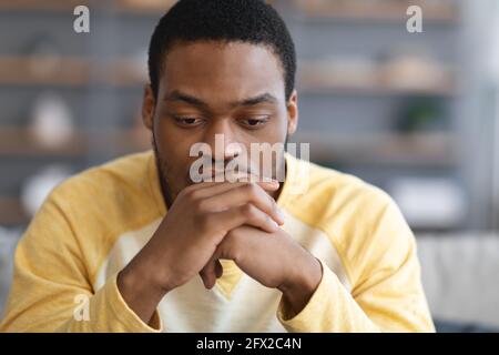 Pensive african american man thinking about something Stock Photo