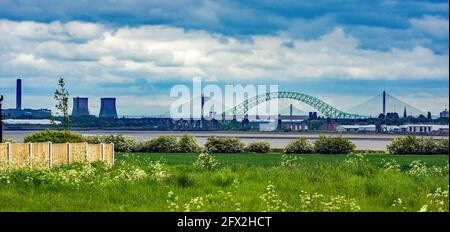 The Silver Jubilee Bridge crosses the River Mersey and the Manchester Ship Canalbetween Runcorn and Widnes, UK. Stock Photo