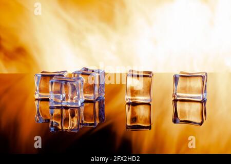 five ice cubes against the flames, copy space Stock Photo