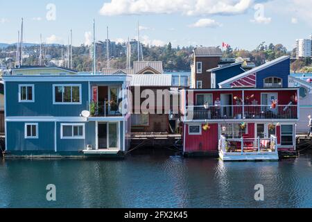 VICTORIA, VANCOUVER ISLAND, CANADA - 2016 SEPT 22:  Beautiful and colourful Float Homes at Fisherman's Wharf, part of a friendly floating village comm Stock Photo