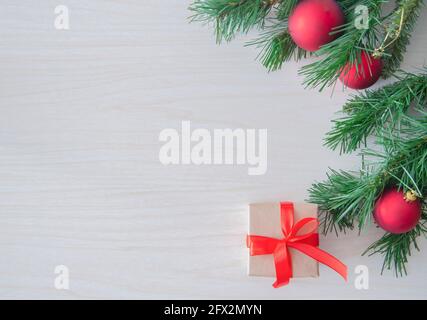 Christmas craft gift boxes on white wooden background. Top view, copy space for text. Greeting, design template, winter holidays background or frame Stock Photo