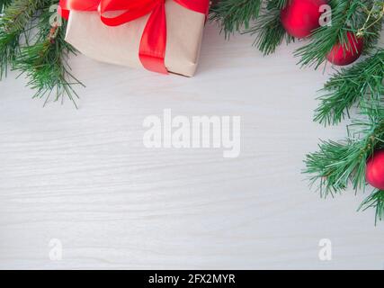 Christmas craft gift boxes on white wooden background. Top view, copy space for text. Greeting, design template, winter holidays background or frame Stock Photo