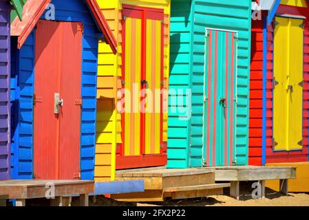 A row of colourful multi-coloured wooden beach huts at Brighton Beach, Melbourne, Victoria State, Australia Stock Photo