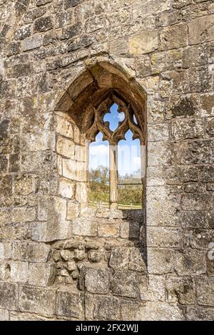 A window in the ruins of St Martins church at Wharram Percy Deserted Medieval Village on the Yorkshire Wolds, North Yorkshire, England UK - Looking ou Stock Photo