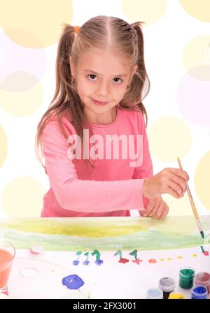 The child, a little girl draws paints isolated on white background Stock Photo