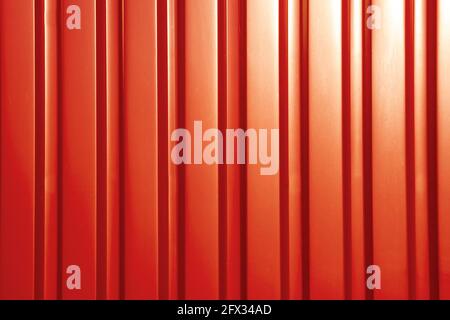 Red sheet metal profile, background. Outdoors of day. Front view. Stock Photo