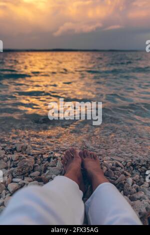 Legs of woman laying at the beach Stock Photo - Alamy