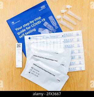 Selection of contents from an NHS Test and Trace Covid 19 Self Test Rapid Antigen Test kit used for home testing for the Coronavirus disease Stock Photo
