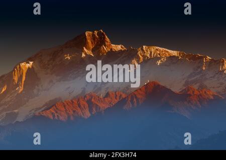 Sunrise on Chaukhamba , a mountain massif in the Gangotri Group of the Garhwal Himalaya. It lies at the head of the Gangotri Glacier at Uttarakhand, I Stock Photo