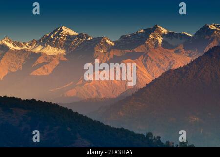 Sunrise on Chaukhamba , a mountain massif in the Gangotri Group of the Garhwal Himalaya. It lies at the head of the Gangotri Glacier at Uttarakhand, I Stock Photo