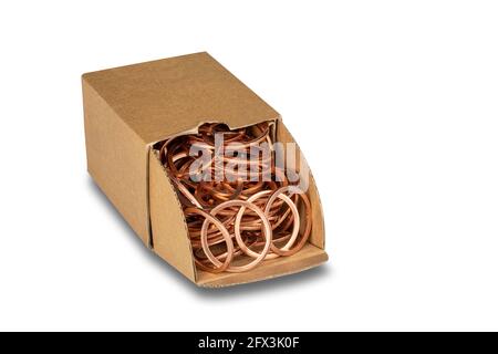 Multiple copper sealing rings in a box on white background Stock Photo