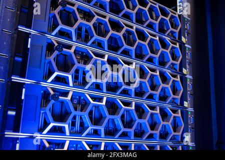 Closeup Of Modern Hard Drives In Illuminated Blue Virtual Datacenter Stock Photo